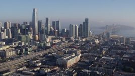5.7K stock footage aerial video pan from I-80 in South of Market near city's skyline, reveal Bay Bridge, Downtown San Francisco, California Aerial Stock Footage | PP0002_000100