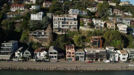 5.7K stock footage aerial video slowly flying by waterfront homes on a hill by Richardson Bay in Sausalito, California Aerial Stock Footage | PP0002_000126