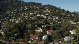 5.7K stock footage aerial video ascend past homes on a hill for a view of neighborhoods at the top in Sausalito, California Aerial Stock Footage | PP0002_000127