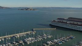 5.7K stock footage aerial video pan from Fort Mason piers to reveal Alcatraz, San Francisco, California Aerial Stock Footage | PP0002_000147