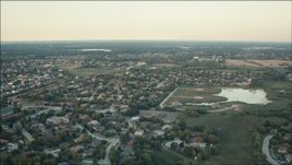 HD aerial stock footage of flying over suburban neighborhoods at sunset in Orland Park, Illinois Aerial Stock Footage | PP001_010