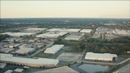 HD aerial stock footage of flying over large warehouse buildings at sunset, Alsip, Illinois Aerial Stock Footage | PP001_015