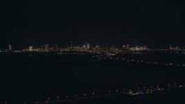 HD stock footage aerial video of approach hotels and casinos of the skyline of Atlantic City, New Jersey at night Aerial Stock Footage | PP003_001