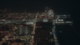 HD stock footage aerial video of flying by hotels and casinos on the shore at night Atlantic City, New Jersey Aerial Stock Footage | PP003_017