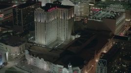 HD stock footage aerial video of tilting from the boardwalk to hotels and casinos at night in Atlantic City, New Jersey Aerial Stock Footage | PP003_032
