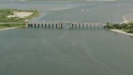 HD stock footage aerial video of approaching a bridge and panning across the water in Point Lookout, New York Aerial Stock Footage | PP003_048