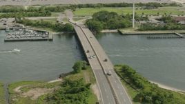 HD stock footage aerial video flyby bridge spanning a river in Point Lookout, New York Aerial Stock Footage | PP003_050