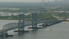 HD stock footage aerial video of tilting from a bridge to reveal the Lower Manhattan skyline, Breezy Point, New York Aerial Stock Footage | PP003_057
