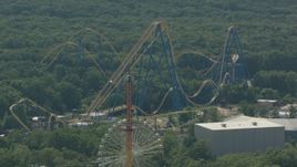 HD stock footage aerial video orbit ride to reveal roller coaster at Six Flags Great Adventure theme park in Jackson, New Jersey Aerial Stock Footage | PP003_071