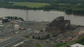 HD stock footage aerial video of passing a riverfront power plant in Burlington, New Jersey Aerial Stock Footage | PP003_082