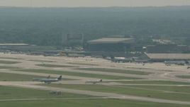 HD stock footage aerial video of commercial planes on the runways at Philadelphia International Airport, Pennsylvania Aerial Stock Footage | PP003_097