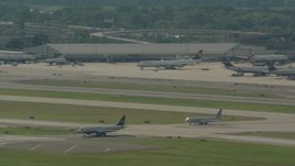 HD stock footage aerial video of a commercial jet taxiing on the runway at Philadelphia International Airport, Pennsylvania Aerial Stock Footage | PP003_098