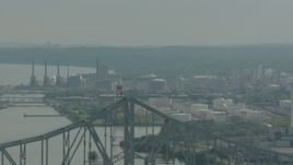 HD stock footage aerial video ascend over the Commodore Barry Bridge to reveal an oil refinery in Chester, Pennsylvania Aerial Stock Footage | PP003_102