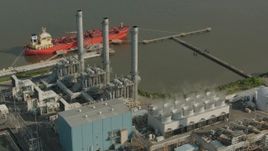 HD stock footage aerial video of riverfront buildings at an oil refinery in Chester, Pennsylvania Aerial Stock Footage | PP003_105