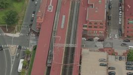 HD stock footage aerial video of a commuter train stopping at the station in Wilmington, Delaware Aerial Stock Footage | PP003_116