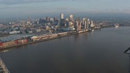 4K aerial stock footage of the Crescent City Connection, reveal Downtown New Orleans at sunrise, Louisiana Aerial Stock Footage | PVED01_020E