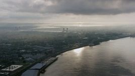 4K aerial stock footage of Bywater and the Mississippi River in New Orleans at sunrise, Louisiana Aerial Stock Footage | PVED01_050