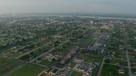 4K aerial stock footage orbit urban residential neighborhoods in the Lower Ninth Ward of New Orleans at sunrise, Louisiana Aerial Stock Footage | PVED01_062