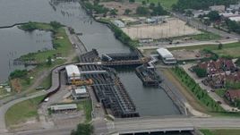4K aerial stock footage orbit 17th Street Canal and the pumping station in Metairie, New Orleans, Louisiana Aerial Stock Footage | PVED01_097E