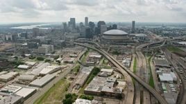 4K aerial stock footage tilt from Interstate 10 in Mid-City to reveal Downtown skyline of New Orleans, Louisiana Aerial Stock Footage | PVED01_110