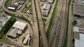 4K aerial stock footage tilt from freeway interchange to reveal Superdome and Downtown New Orleans, Louisiana Aerial Stock Footage | PVED01_111E