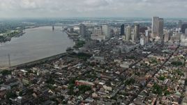 4K aerial stock footage wide orbit of French Quarter, Downtown New Orleans and the Mississippi River, Louisiana Aerial Stock Footage | PVED01_117