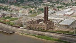 4K aerial stock footage approach riverfront power plant in the Garden District of New Orleans, Louisiana Aerial Stock Footage | PVED01_132