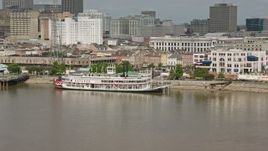 4K aerial stock footage of Steamboat Natchez on the French Quarter riverfront in New Orleans, Louisiana Aerial Stock Footage | PVED01_135