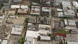 4K aerial stock footage tilt to reveal and fly over Downtown New Orleans skyscrapers toward French Quarter, Louisiana Aerial Stock Footage | PVED01_140E