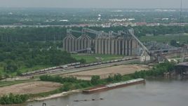 4K aerial stock footage factory silos on the shore of the Mississippi River in New Orleans, Louisiana Aerial Stock Footage | PVED01_151