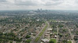 4K aerial stock footage tilt from Garden District suburbs to reveal Downtown New Orleans skyline, Louisiana Aerial Stock Footage | PVED01_155