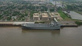 4K aerial stock footage orbit two Naval Reserve warships docked on the Mississippi River in Bywater, New Orleans, Louisiana Aerial Stock Footage | PVED01_161