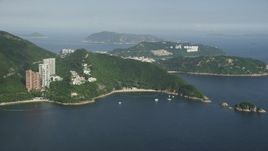 5K stock footage aerial video approach Hong Kong Island waterfront apartment Buildings from Repulse Bay in China Aerial Stock Footage | SS01_0054