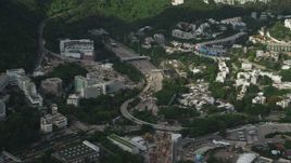 5K stock footage aerial video of apartment buildings around freeway with heavy traffic on Hong Kong Island, China Aerial Stock Footage | SS01_0078