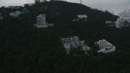 5K stock footage aerial video fly over condo complexes near the summit of a peak on Hong Kong Island, China Aerial Stock Footage | SS01_0081