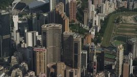 5K stock footage aerial video reverse view of Times Square Towers and reveal race track on Hong Kong Island, China Aerial Stock Footage | SS01_0100