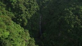 5K stock footage aerial video of reverse view of waterfall and forest in the mountains of Hong Kong Island, China Aerial Stock Footage | SS01_0110