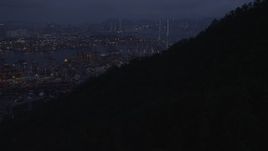 5K stock footage aerial video tilt to reveal the Port of Hong Kong and the Stonecutters Bridge at night, China Aerial Stock Footage | SS01_0111