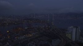 5K stock footage aerial video fly over the Port of Hong Kong to approach Stonecutters Bridge at night, China Aerial Stock Footage | SS01_0113