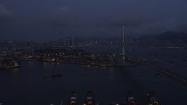 5K stock footage aerial video of flying by Stonecutters Bridge to approach part of the Port of Hong Kong at night in China Aerial Stock Footage | SS01_0116