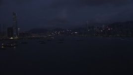 5K stock footage aerial video approach the skyline of Hong Kong Island at night, China Aerial Stock Footage | SS01_0124