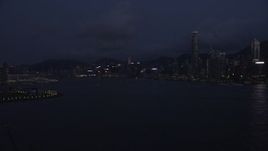 5K stock footage aerial video of approaching Hong Kong Island skyline and the harbor at night, China Aerial Stock Footage | SS01_0127