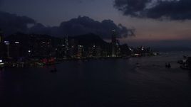 5K stock footage aerial video skyline of Hong Kong Island, Victoria Harbor at nighttime in China Aerial Stock Footage | SS01_0141