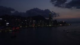 5K stock footage aerial video waterfront skyline of Hong Kong Island and Victoria Harbor at night, China Aerial Stock Footage | SS01_0142