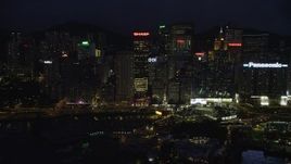 5K stock footage aerial video of waterfront high-rises and office buildings at night on Hong Kong Island, China Aerial Stock Footage | SS01_0155