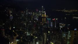 5K stock footage aerial video approach and pan across tall towers of Hong Kong Island at night, China Aerial Stock Footage | SS01_0177