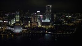 5K stock footage aerial video approach waterfront concert hall, museum and towers at night in Kowloon, Hong Kong, China Aerial Stock Footage | SS01_0189