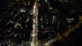 5K stock footage aerial video of following Nathan Road past office buildings at night in Kowloon, Hong Kong, China Aerial Stock Footage | SS01_0195