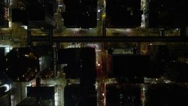 5K stock footage aerial video of a bird's eye view of crowded city streets at night through Kowloon, Hong Kong, China Aerial Stock Footage | SS01_0200