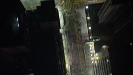 5K stock footage aerial video a bird's eye view of pedestrians on city streets at night in Kowloon, Hong Kong, China Aerial Stock Footage | SS01_0213